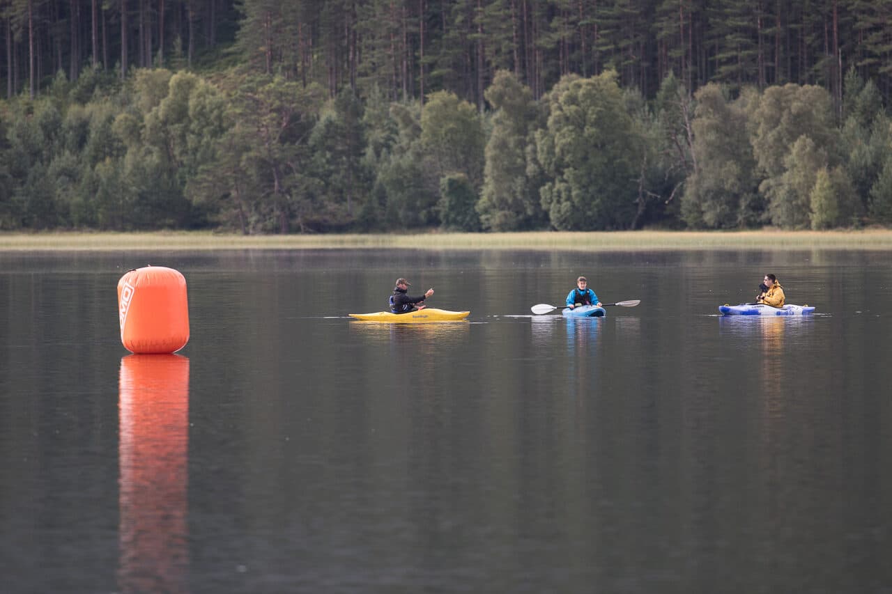 Aviemore Triathlon: buoy and safety crew on the water at the aviemore triathlon