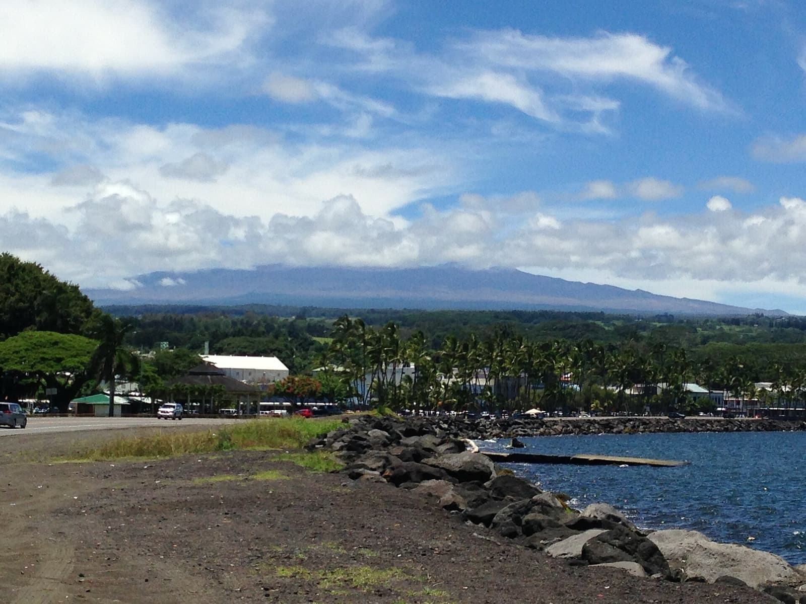 Big Island International Marathon 2027 30 years running the old coast of Hawaii: hilo bayfront with mauna kea behind (not race day) — destination scenery near hilo; not a photo of this event.