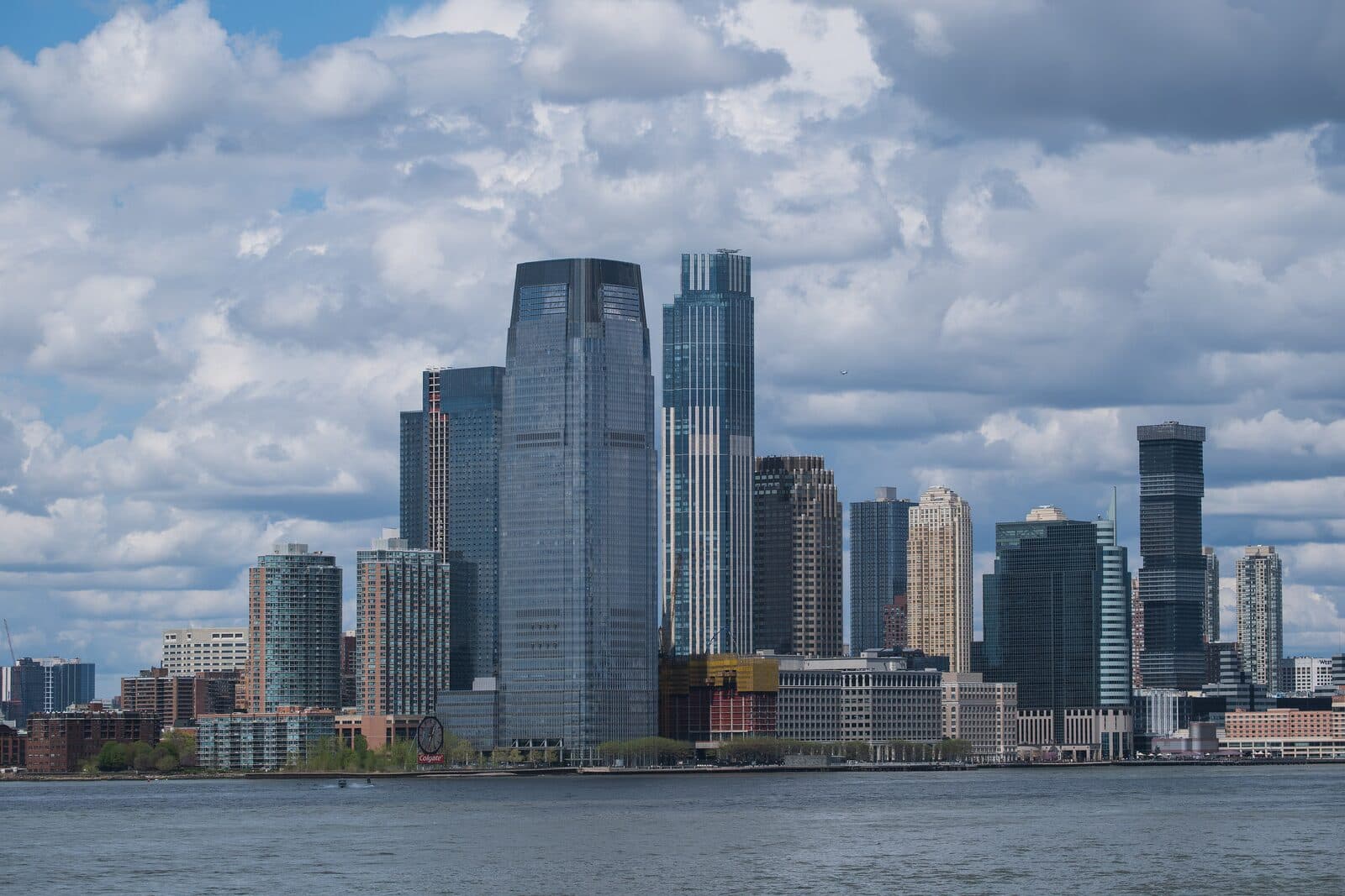 The Jersey City Marathon & Half Marathon Marquee Experience at Newport: jersey city waterfront and the colgate clock, seen from the hudson river — destination scenery near jersey city; not a photo of this event.
