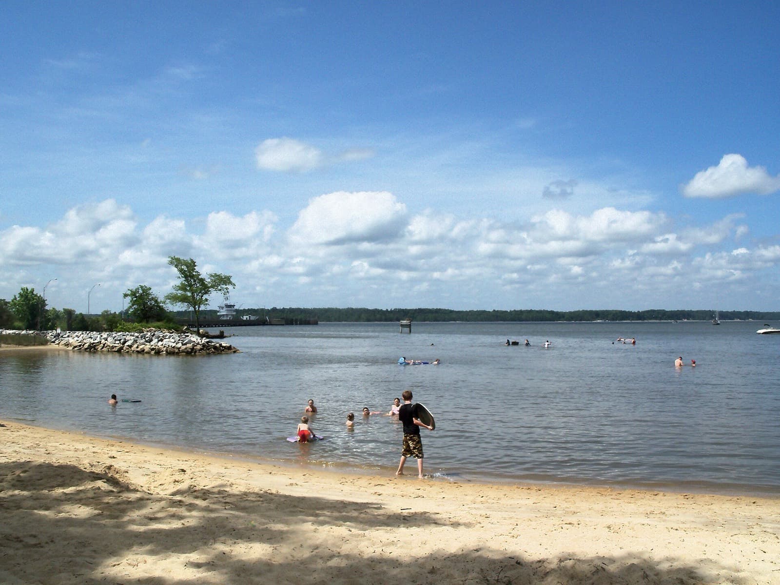 Run the River Ultra: jamestown beach on the james river with the ferry terminal in the distance (venue, not race day) — destination scenery near williamsburg; not a photo of this event.