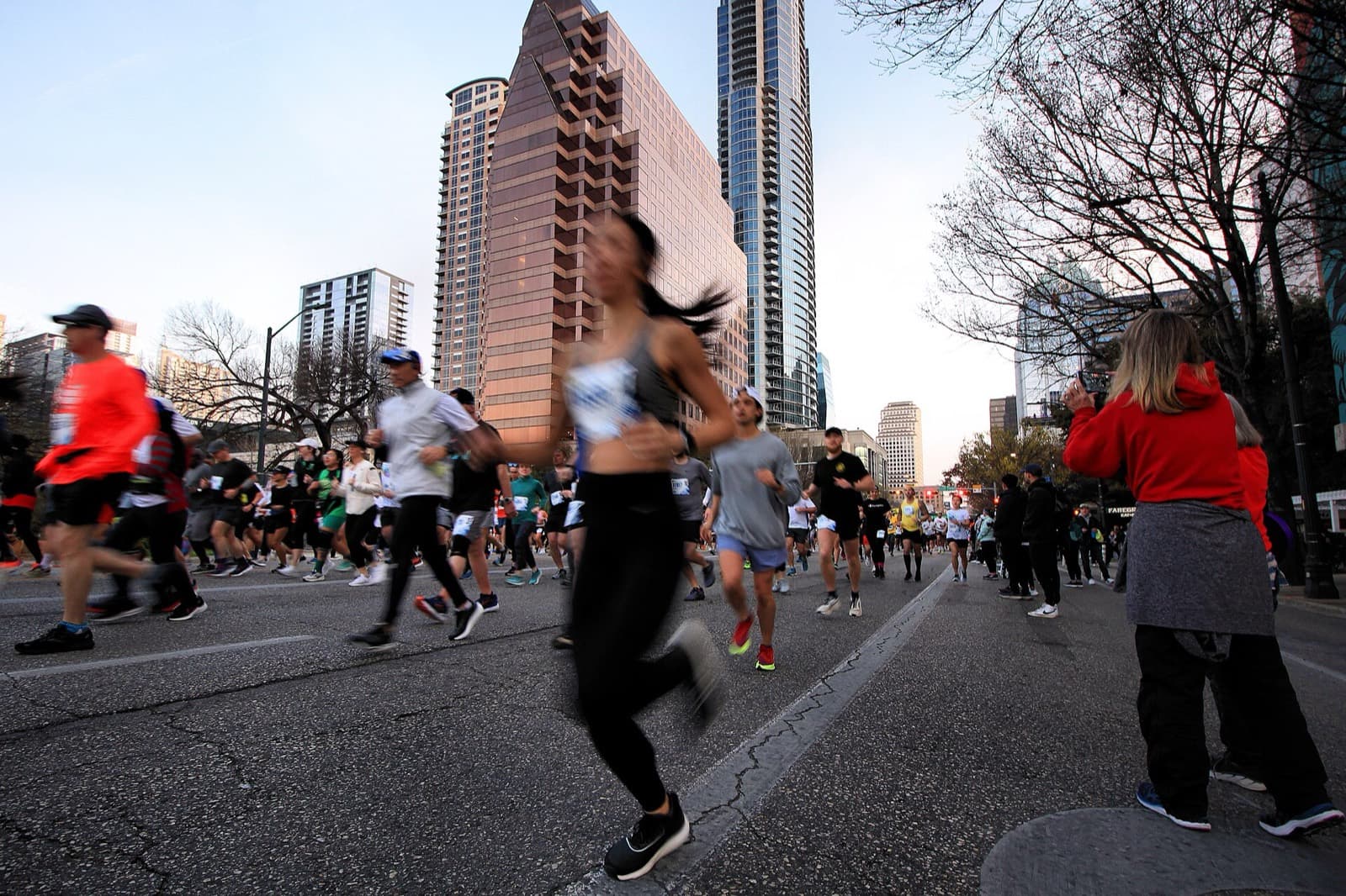 Ascension Seton Austin Marathon: runners on congress avenue after the 2023 start with the downtown skyline