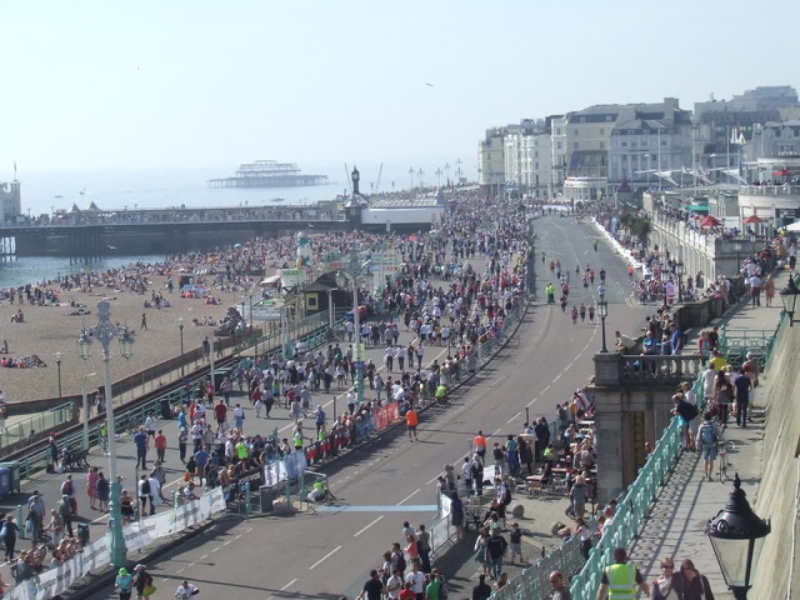Brighton Marathon: runners and crowds on the seafront road toward the palace pier, 2011