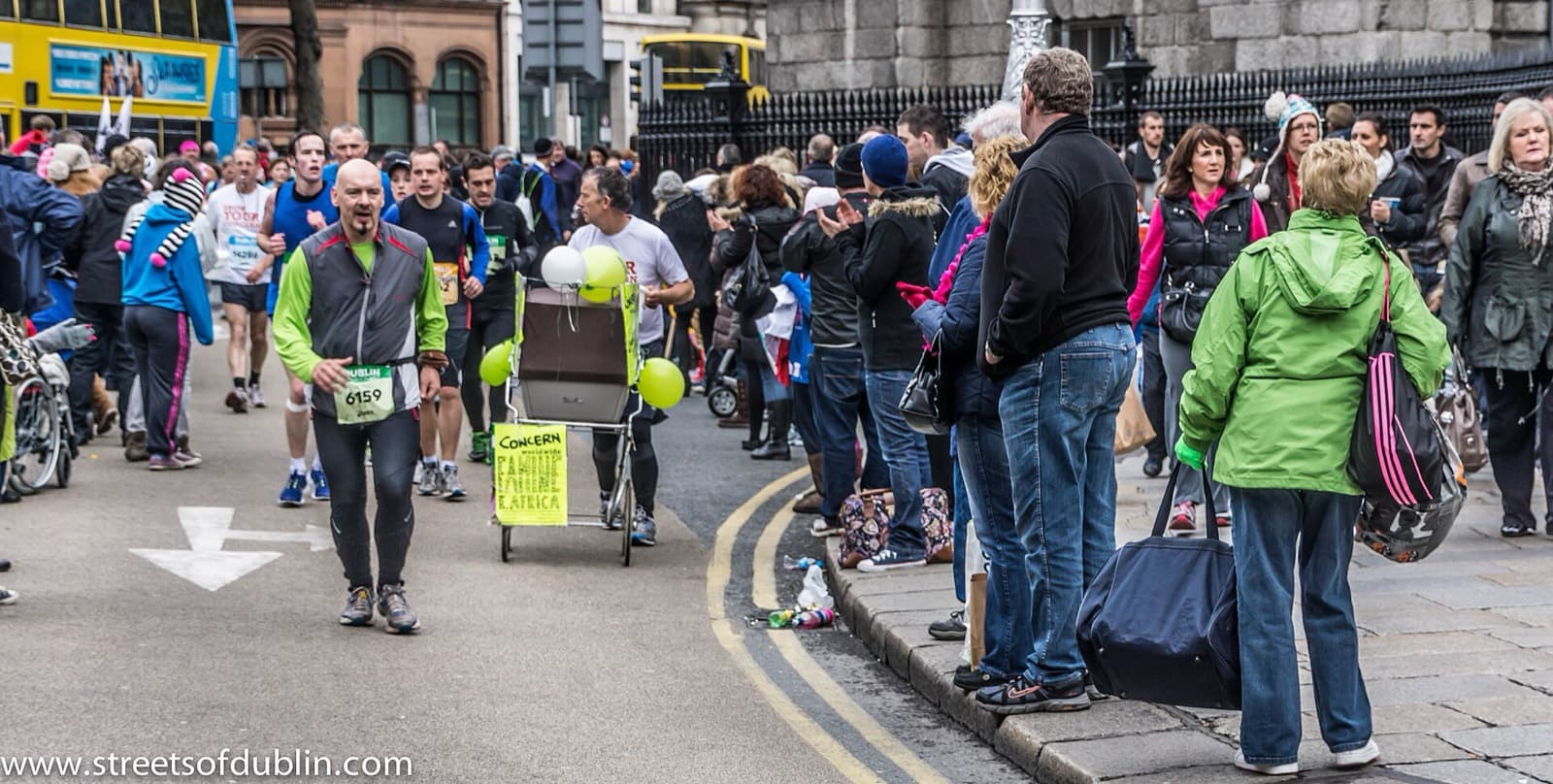 SSE Airtricity Dublin Marathon: runners and spectators on a dublin street, 2012