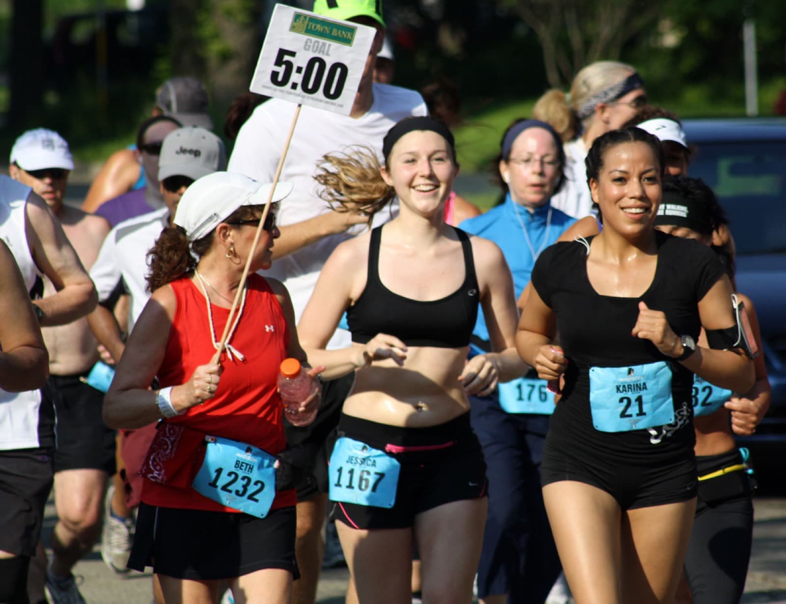 Madison Marathon: runners and a 5:00 pace sign at the madison marathon (may-era edition)