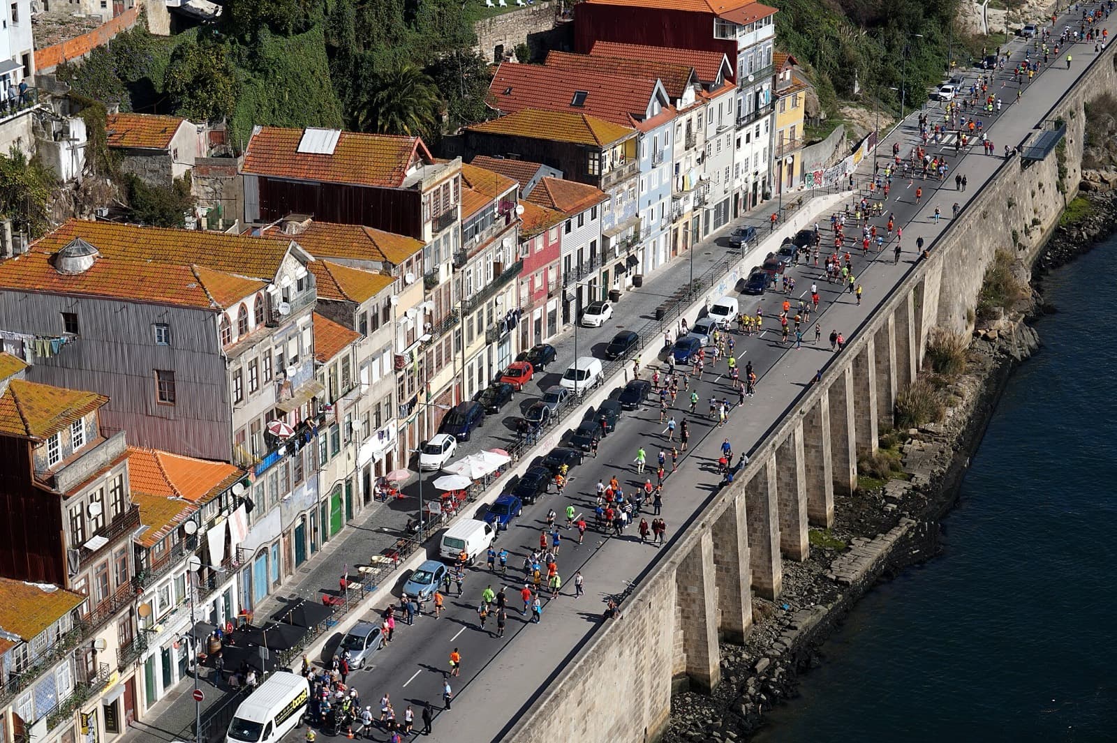 EDP Porto Marathon: aerial view of runners along the douro waterfront below ribeira