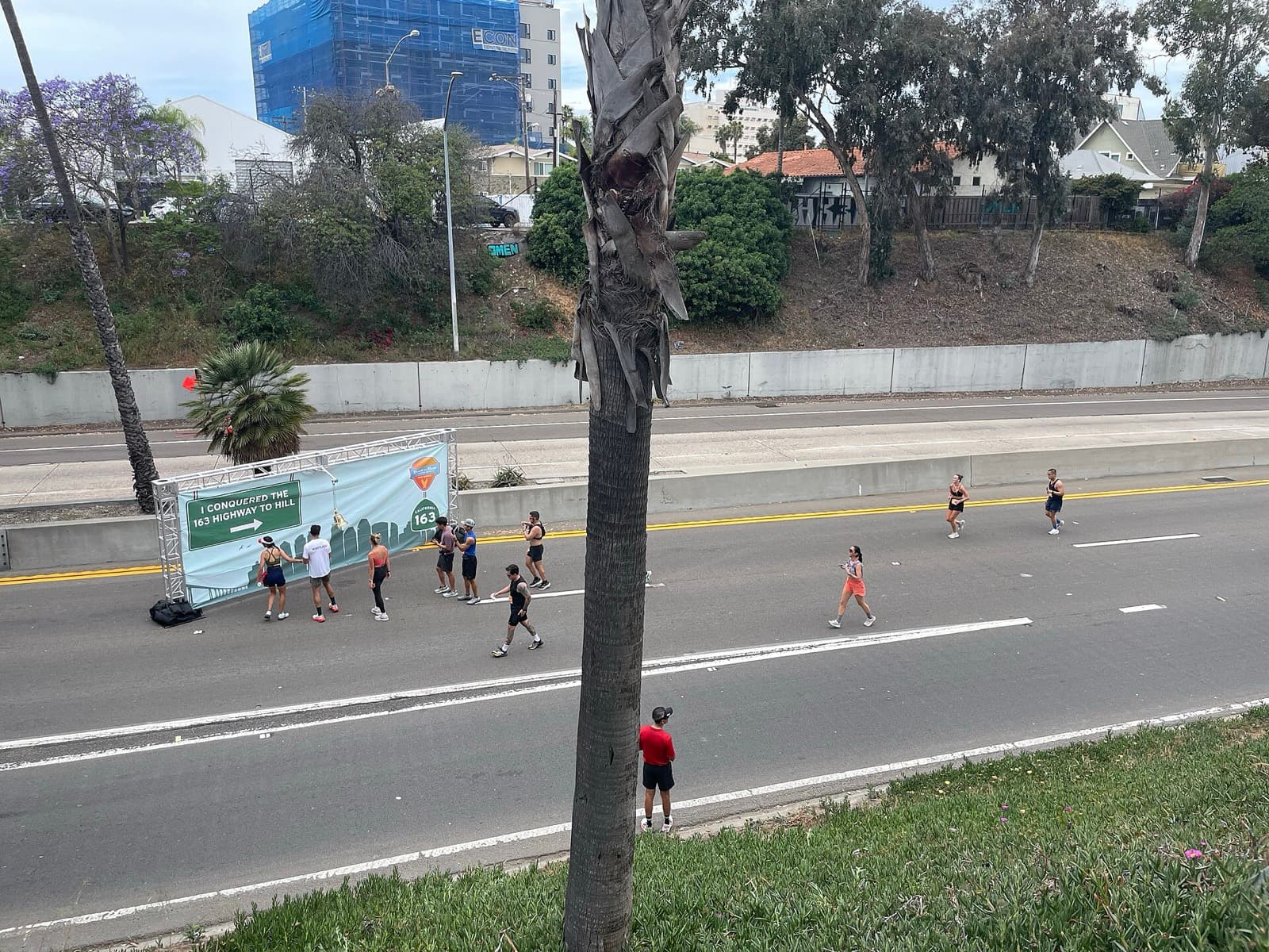Rock 'n' Roll San Diego Marathon: runners on the closed highway 163 lanes near the highway to hill banner, 2025
