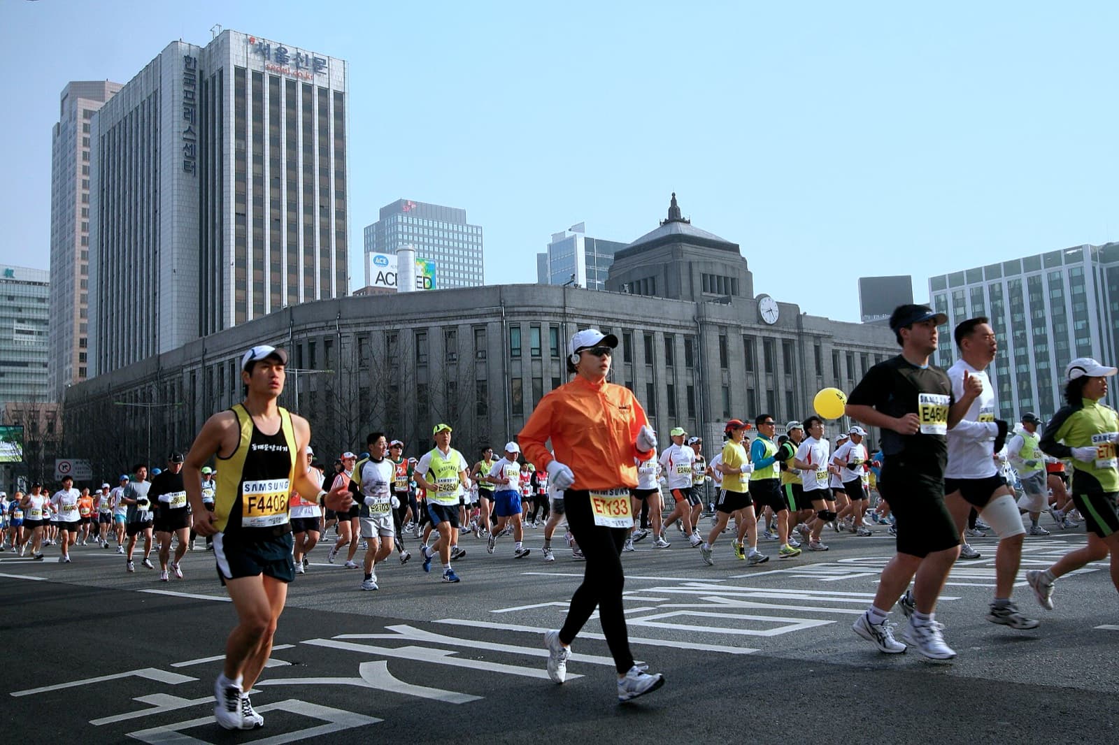 Seoul International Marathon (Dong-A): runners on a downtown seoul street during the seoul international marathon