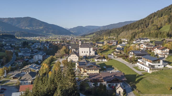 Flachau village and the Enns valley mountains in autumn sun