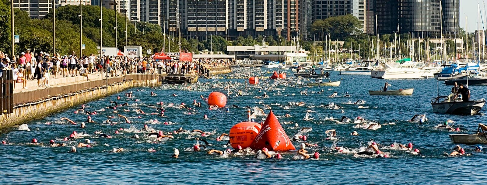 Chicago Triathlon (Supertri): swimmers in monroe harbor at the 2007 chicago triathlon, spectators on the seawall