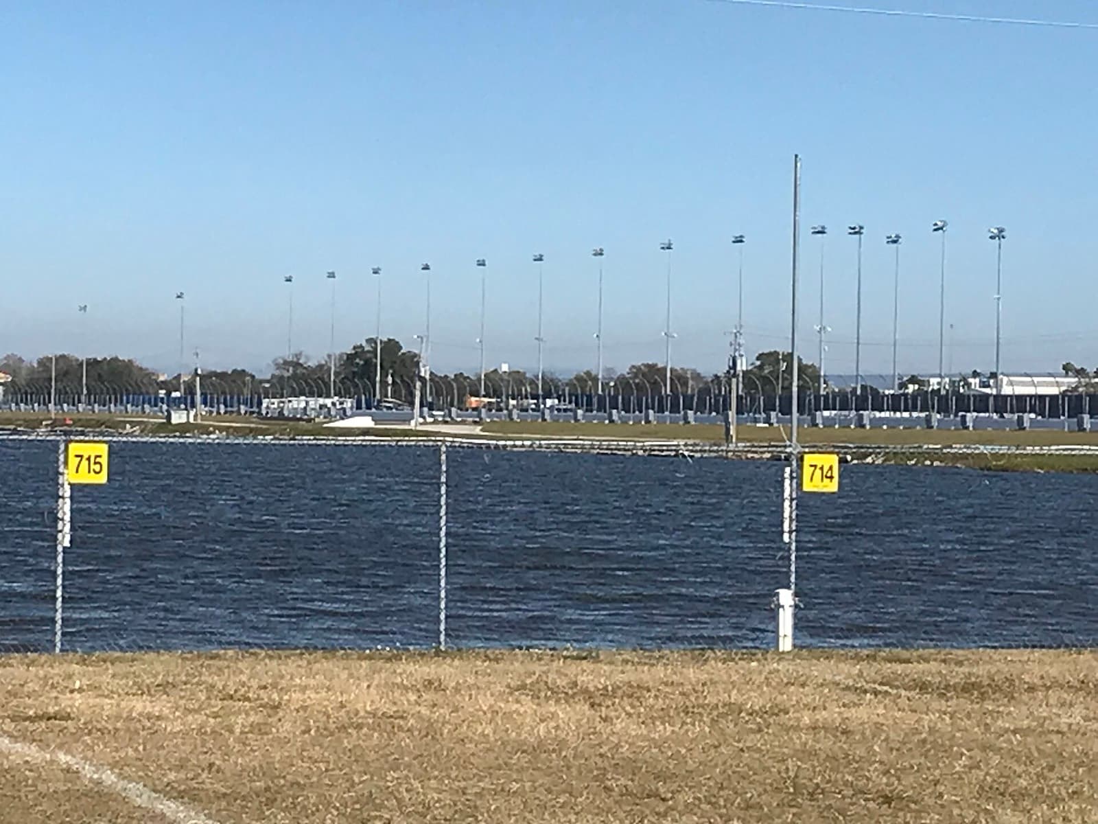 CLASH Endurance Daytona Sprint Triathlon: lake lloyd, the swim venue, with the speedway behind