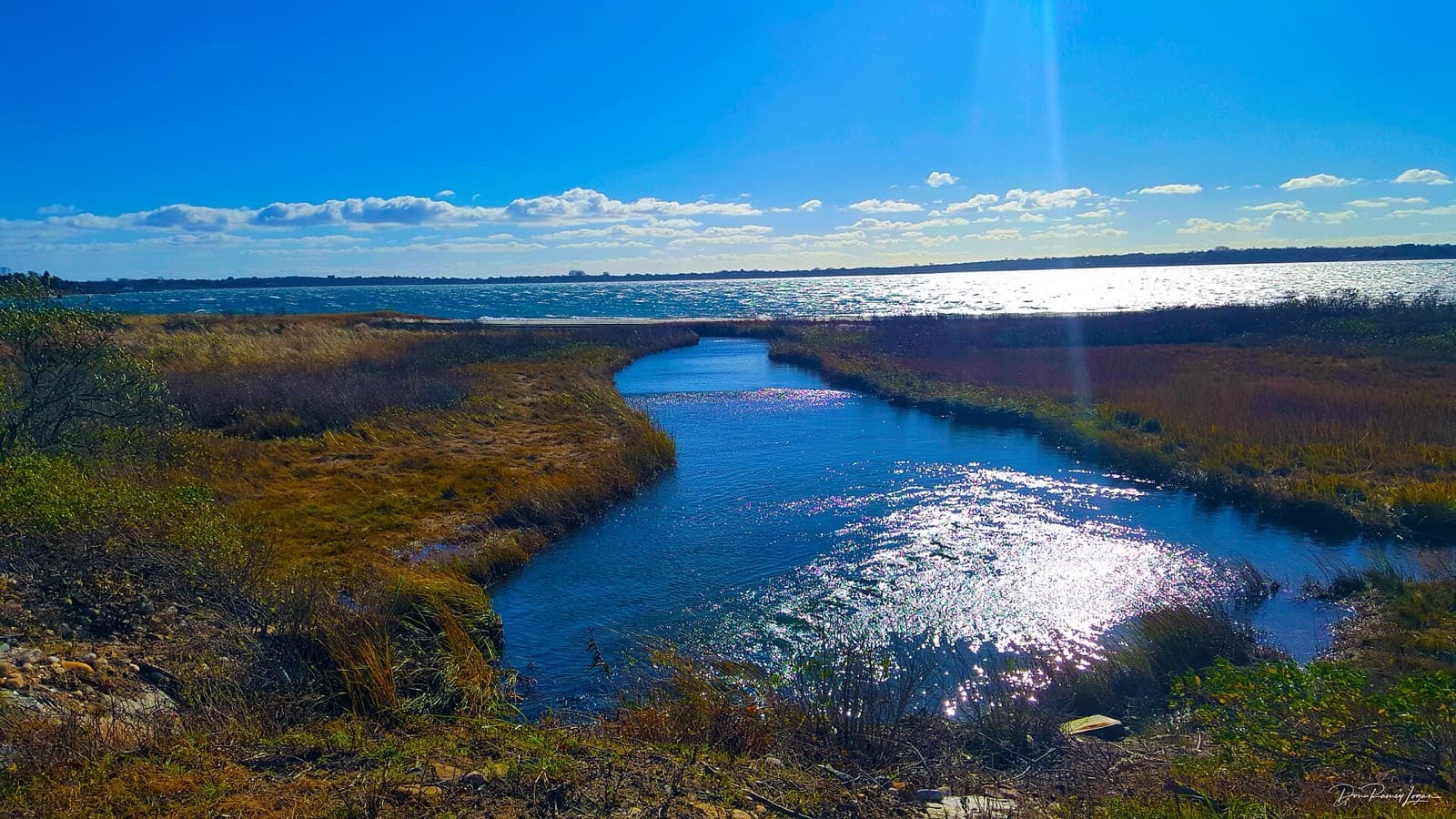 RJA Memorial Mighty Montauk Triathlon: lake montauk tidal inlet and bay under blue sky, the swim venue
