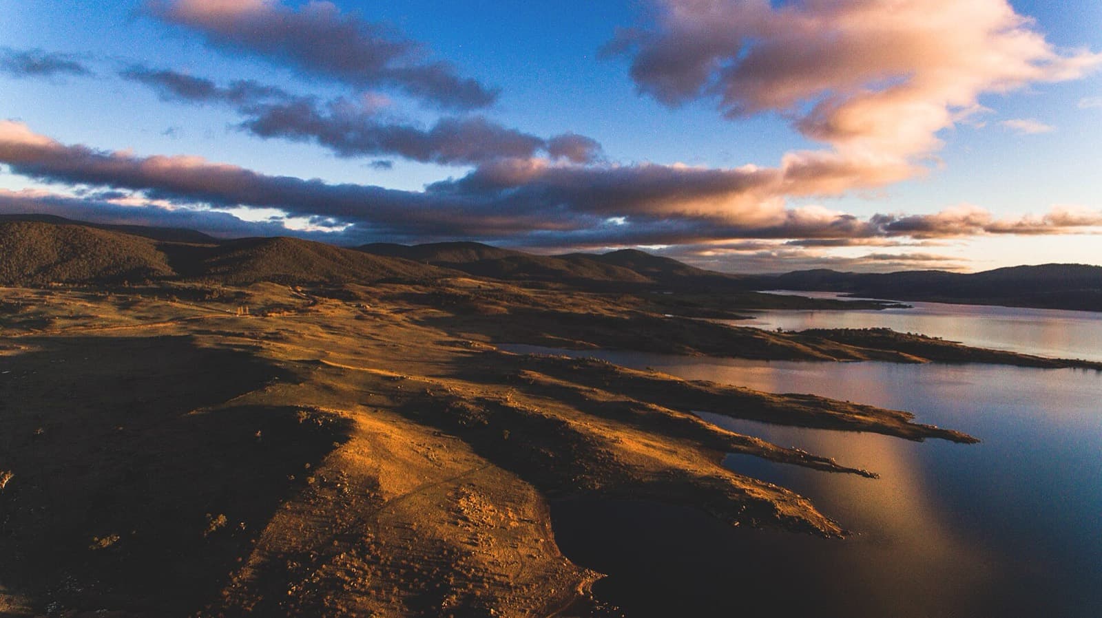 Australian Alpine Ascent XTRI: lake jindabyne at sunset, snowy mountains