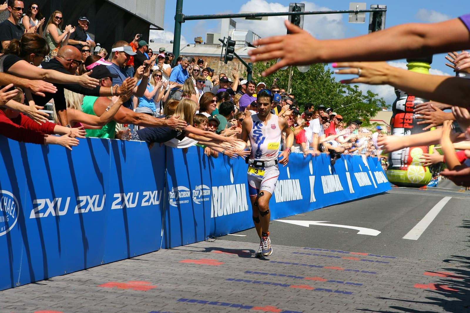IRONMAN 70.3 Coeur d'Alene: athlete finishing the ironman coeur d'alene 2012 finish chute in downtown coeur d'alene (full-distance race, same city and finish area as the 70.3)