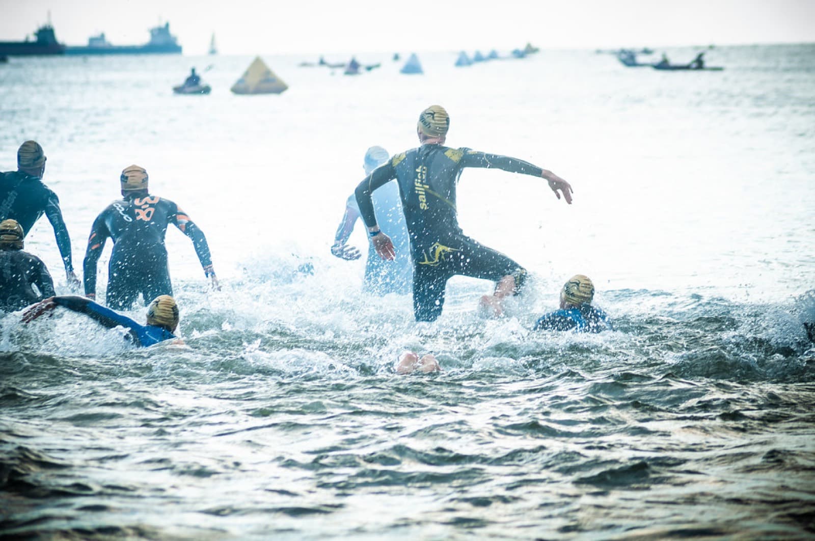IRONMAN 70.3 Gdynia: swimmers running into the baltic at the ironman 70.3 gdynia swim start (2018 race day)