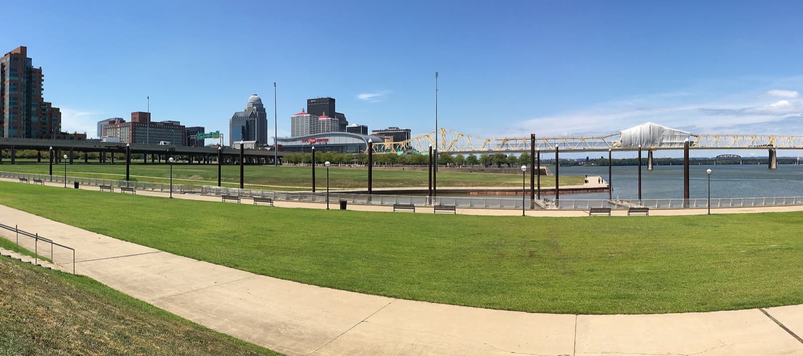 IRONMAN 70.3 Louisville: waterfront park great lawn and ohio river with louisville skyline (cropped panorama)