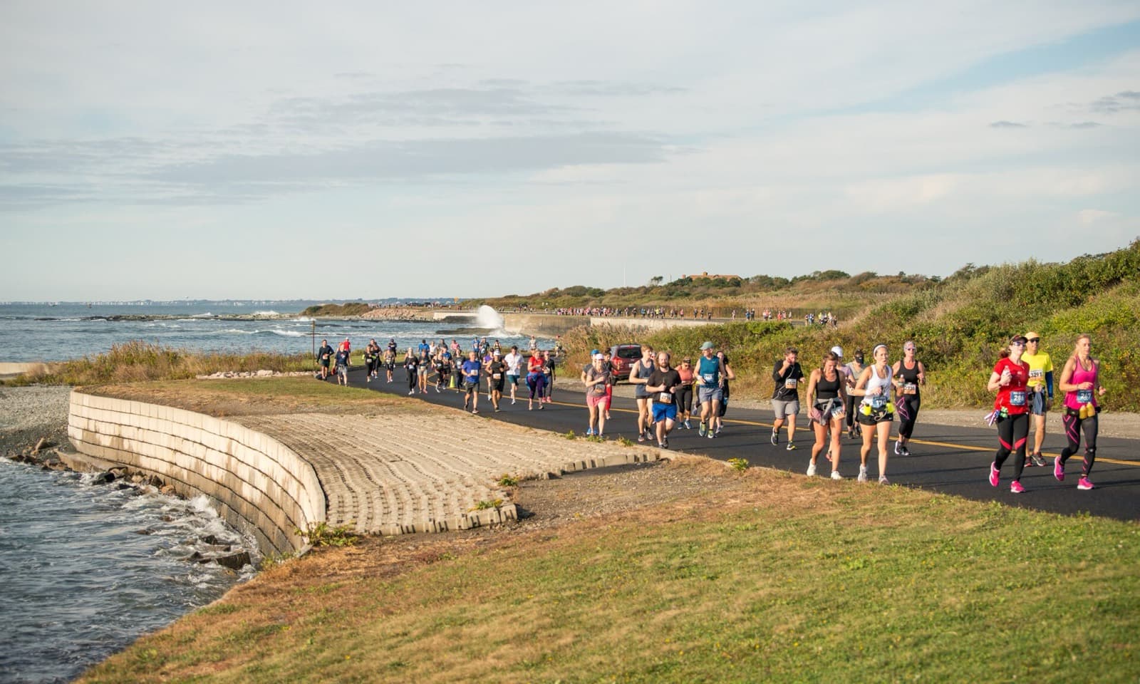 Amica Newport Marathon: runners on the ocean drive coastal road during the amica newport marathon
