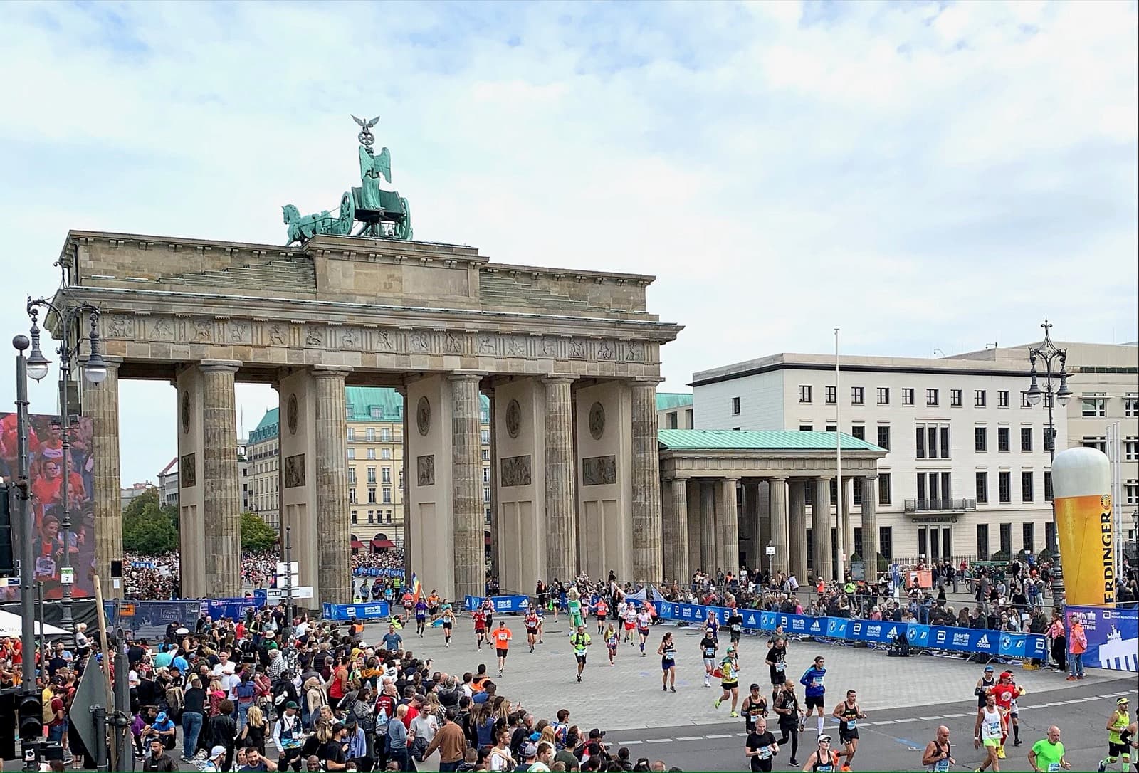 BMW Berlin Marathon: runners and crowds at the brandenburg gate finish