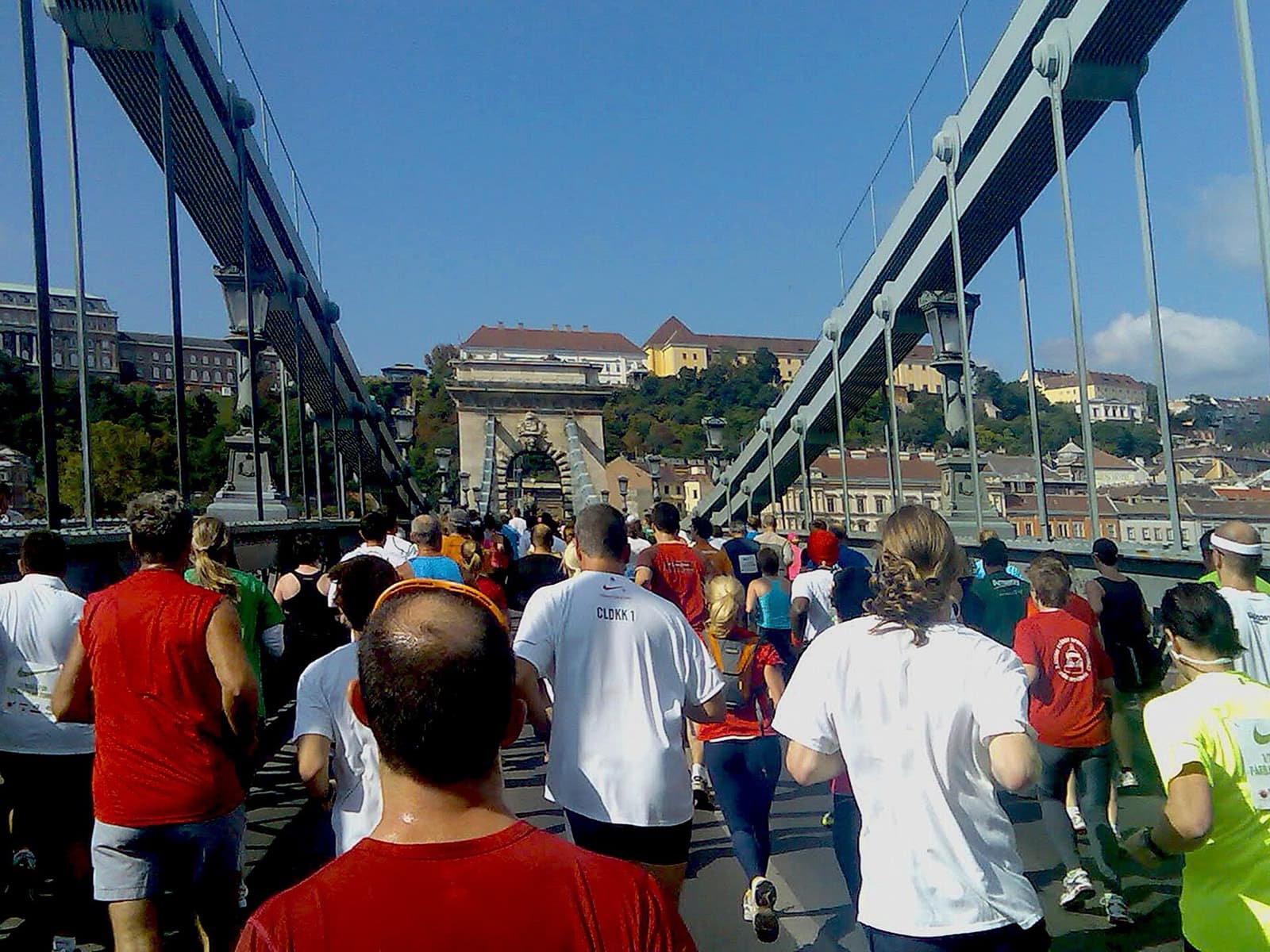 SPAR Budapest Marathon: runners crossing the chain bridge toward buda castle during the budapest half marathon