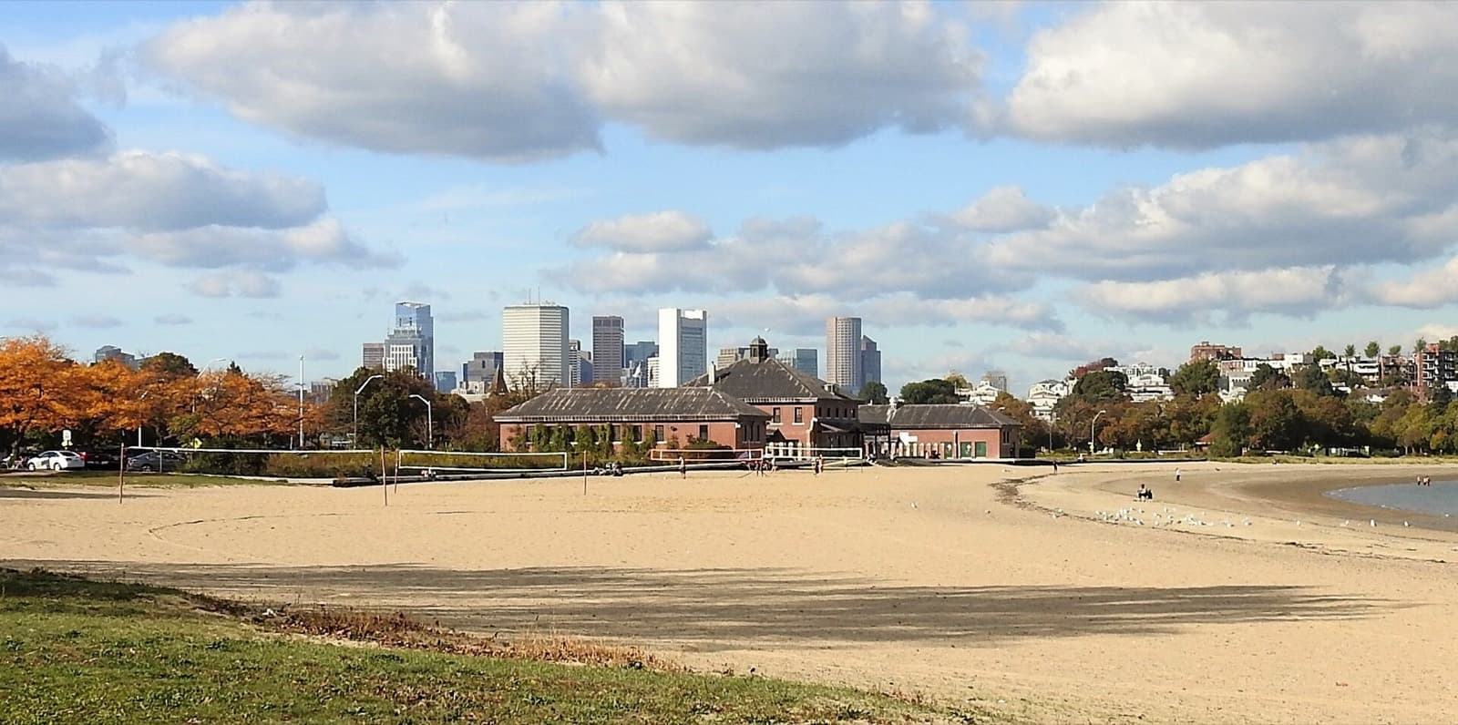 The Boston Triathlon: carson beach and bathhouse with boston skyline (swim venue)