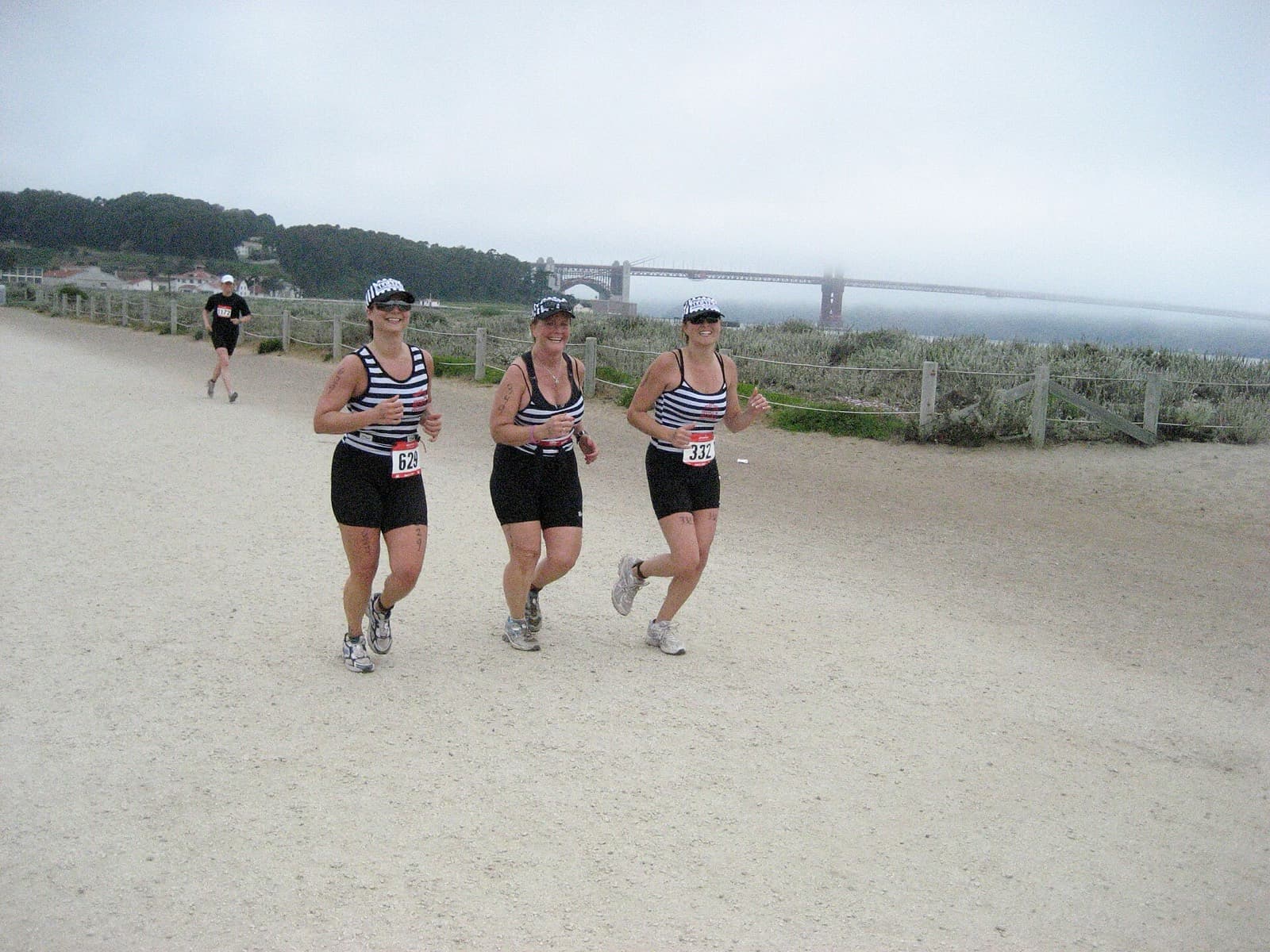 Escape from Alcatraz Triathlon: runners near golden gate bridge in fog