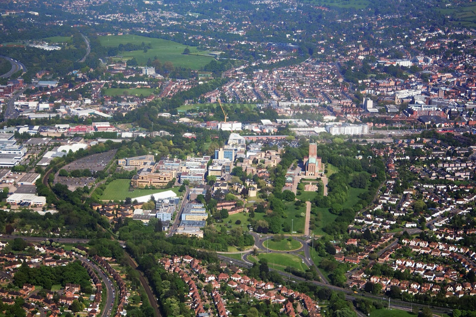 Guildford Triathlon (RunThrough, Surrey Sports Park): aerial view of the university of surrey and guildford cathedral on stag hill, next to the venue