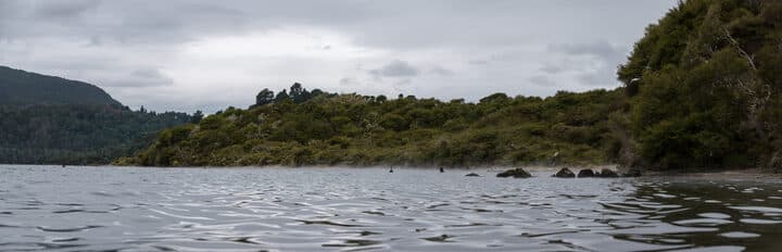 Lake Tarawera shoreline with geothermal steam near Rotorua, New Zealand; outside race day