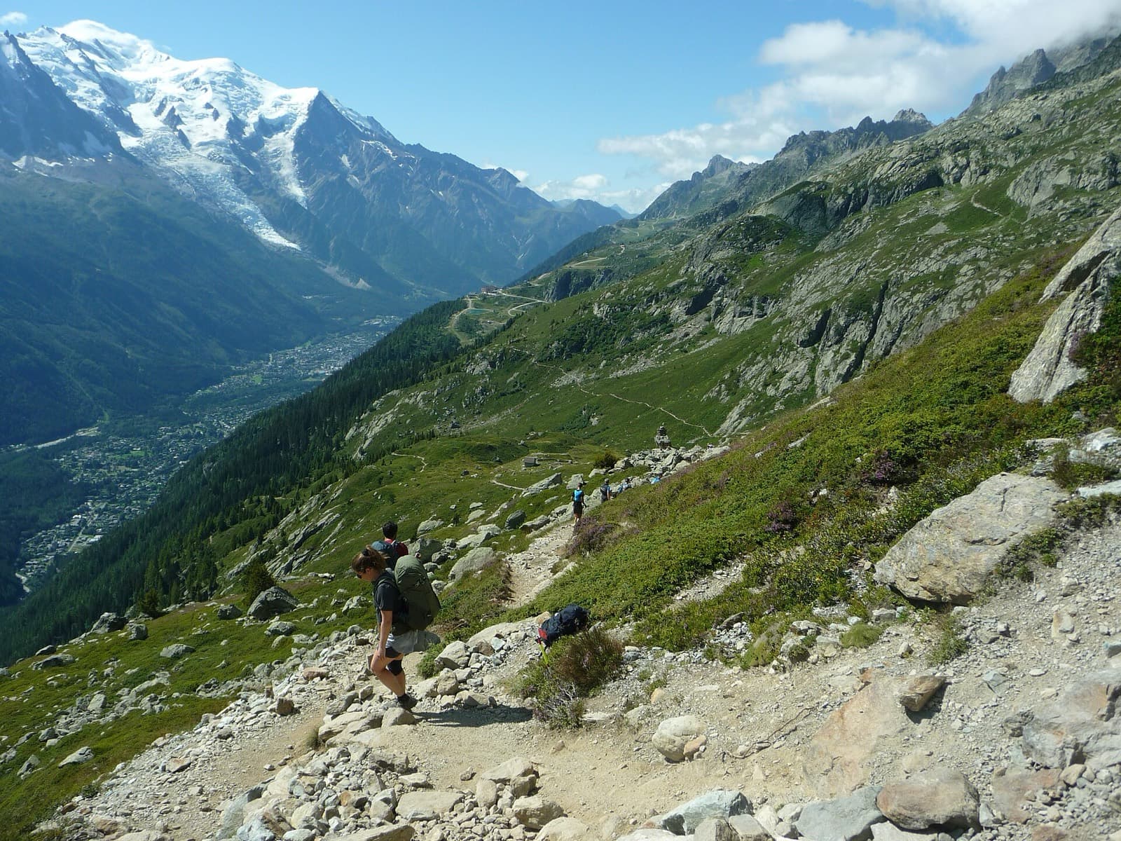 UTMB Mont-Blanc 100M (the 171 km UTMB, not CCC or OCC): runners descending toward chamonix from la flégère with the mont blanc massif behind